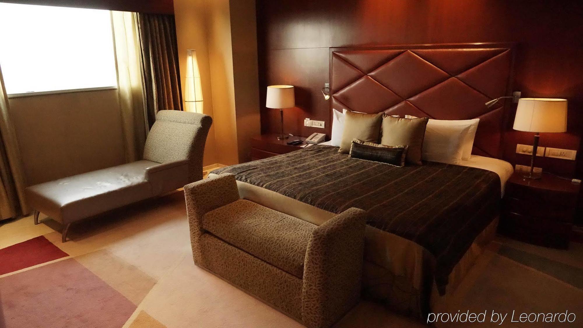 Taj Chandigarh Ngoại thất bức ảnh A bedroom in the hotel